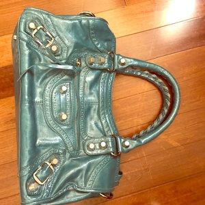 Teal shoulder bag with lots of pockets